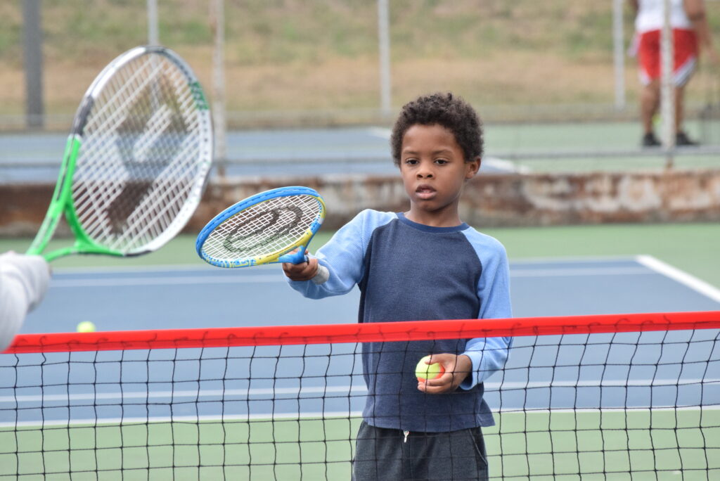 Boy playing tennis