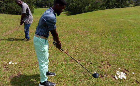 Akoi Flomo golfing on course