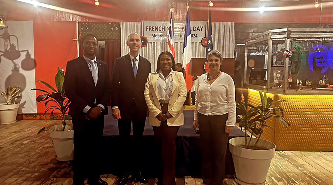 Tunde Thomas posing with French Embassy on Bastille Day