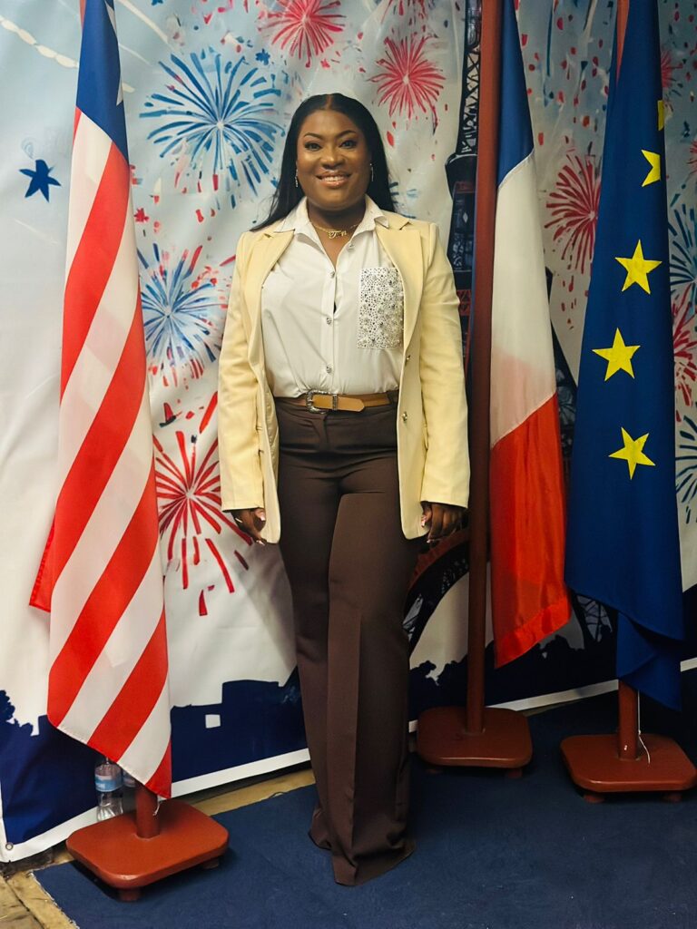 Thomas posing between Liberian and French flag Thomas posing between Liberian and French flag