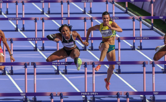 Ebony Morrison jumping over hurdle in Paris2024 women's 100mH repechage round